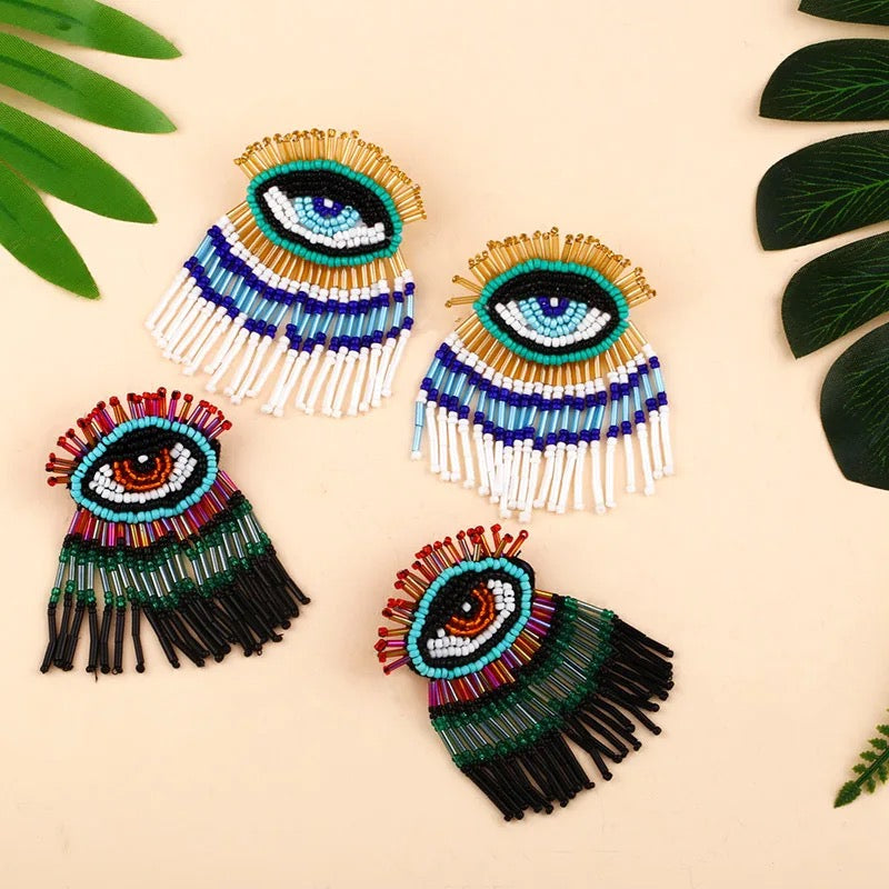 Green evil earrings
